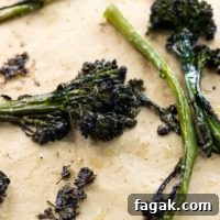 crispy broccolini roasted to perfection on a sheet pan