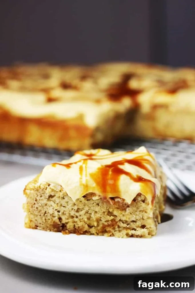 a piece of banana caramel cake with caramel frosting on a white plate