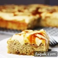 a piece of banana caramel cake with caramel frosting on a white plate