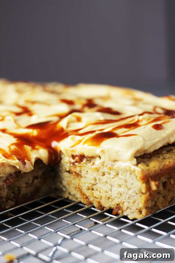 Banana caramel cake with caramel frosting, drizzled with caramel