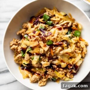 egg roll in a bowl in two white bowls