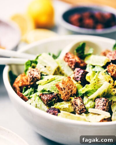 Close up of vegan Caesar salad topped with parmesan and croutons