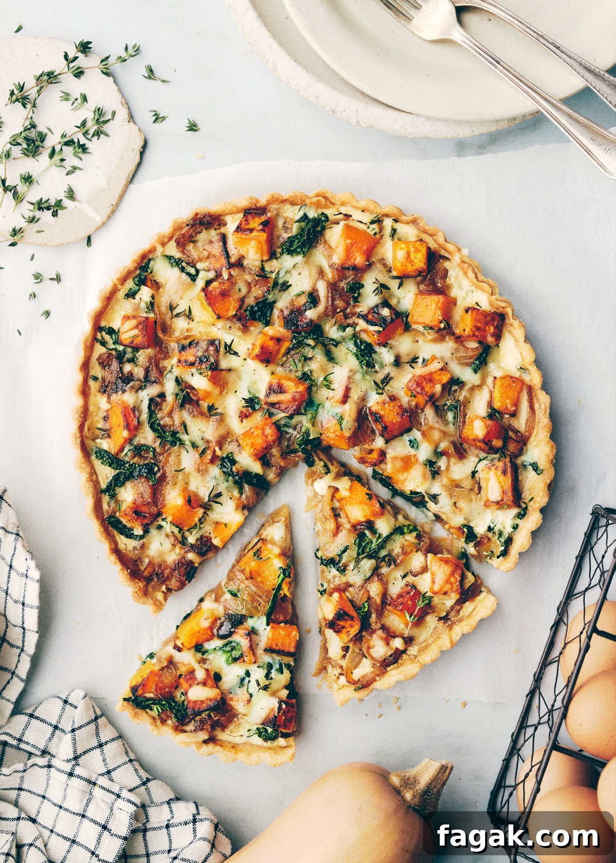 Quiche and butternut squash on a counter