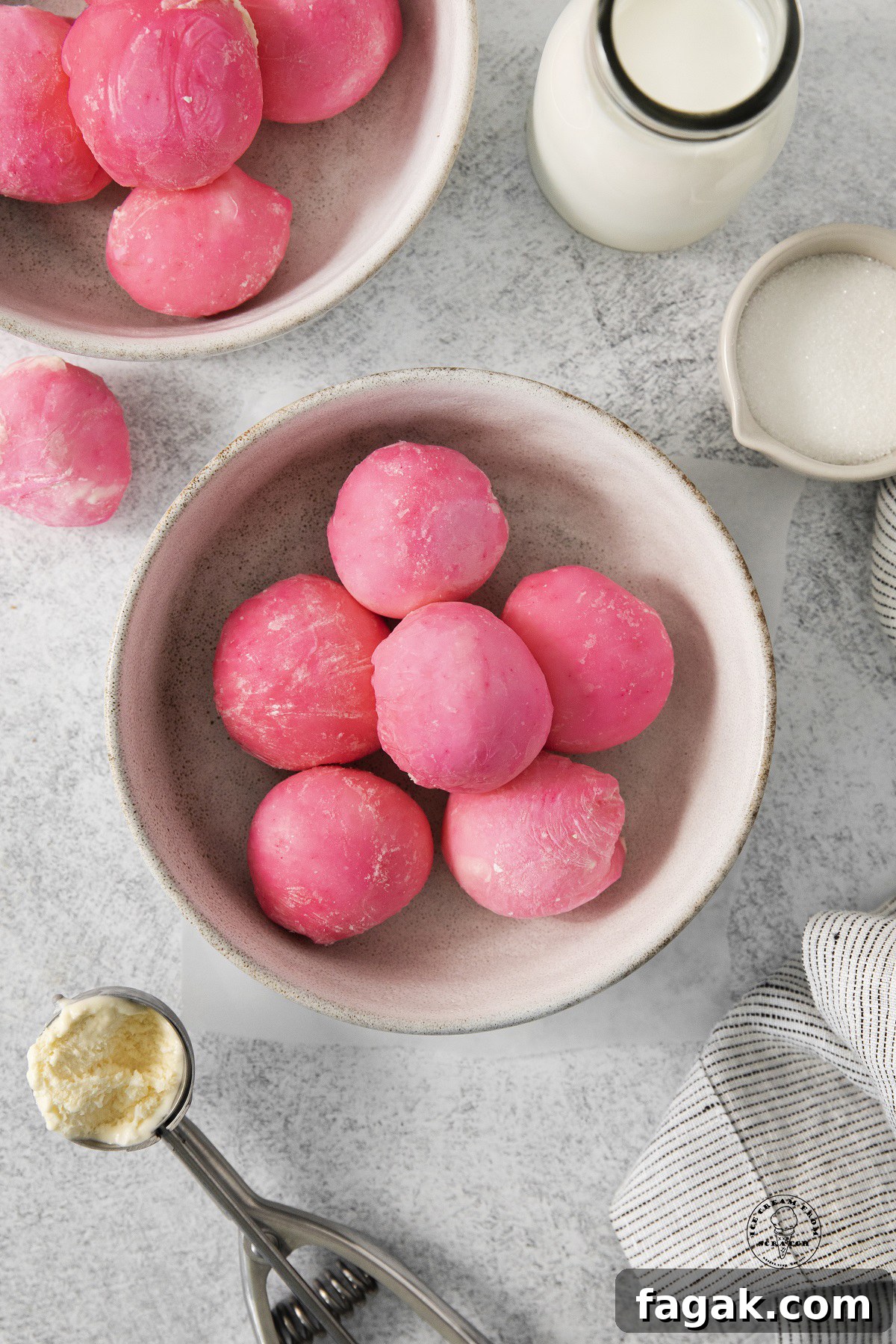 a bowl filled with homemade pink mochi ice cream balls