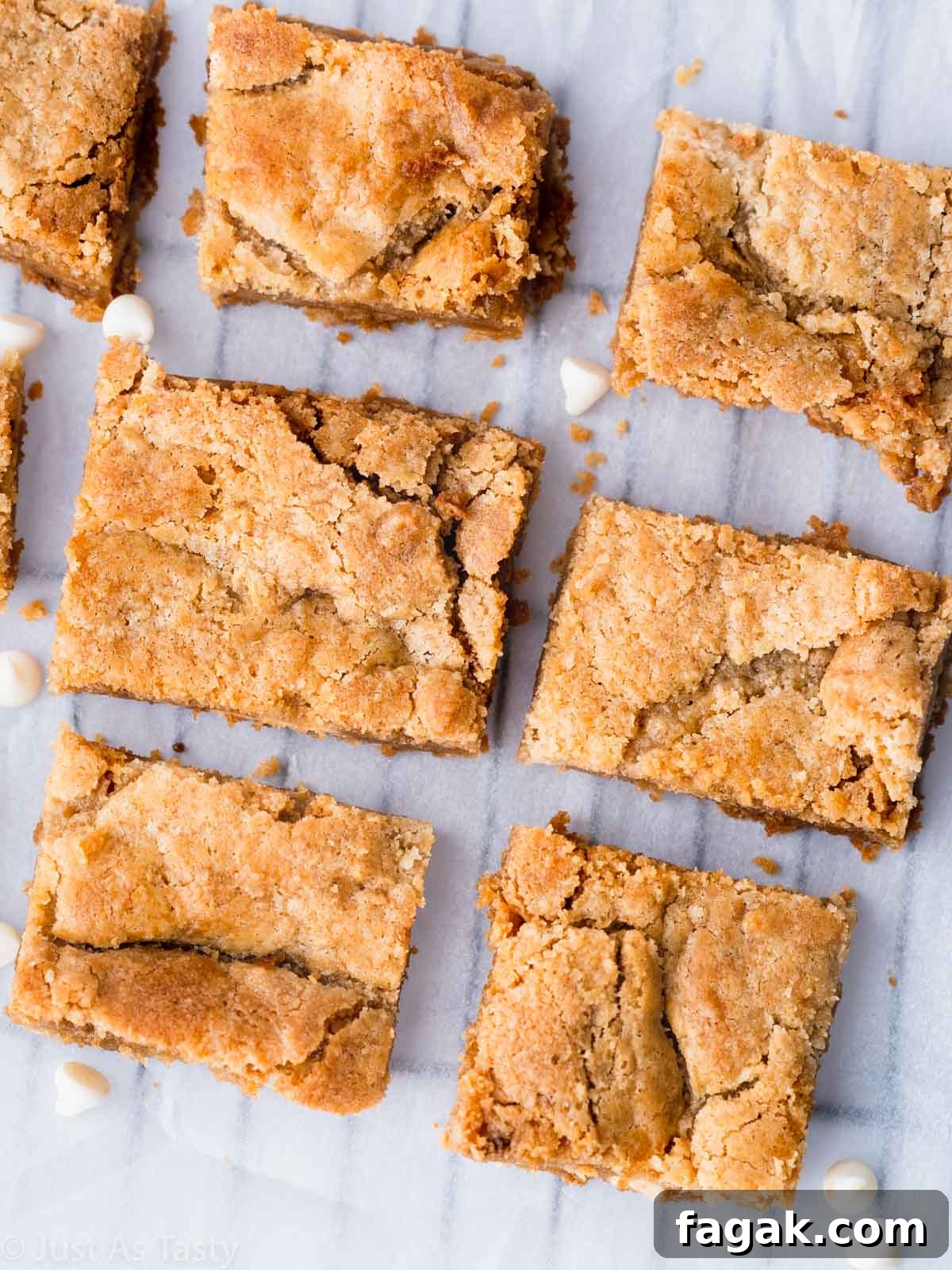 Decadent White Chocolate Brownie Recipe for Ultimate Indulgence 3 White chocolate brownies on parchment paper.