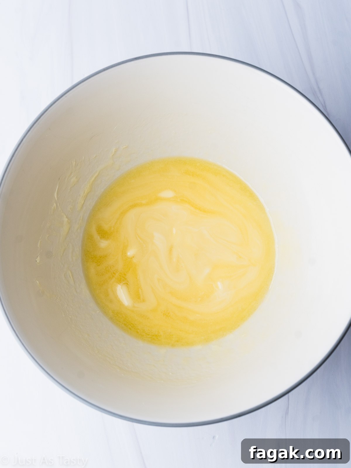 Decadent White Chocolate Brownie Recipe for Ultimate Indulgence 5 Melted butter and white chocolate in a bowl.