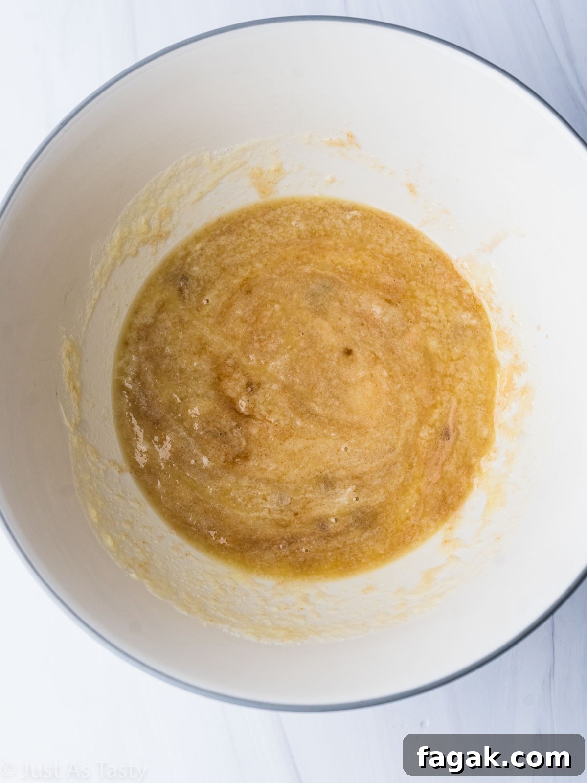 Decadent White Chocolate Brownie Recipe for Ultimate Indulgence 6 Wet ingredients in a bowl.