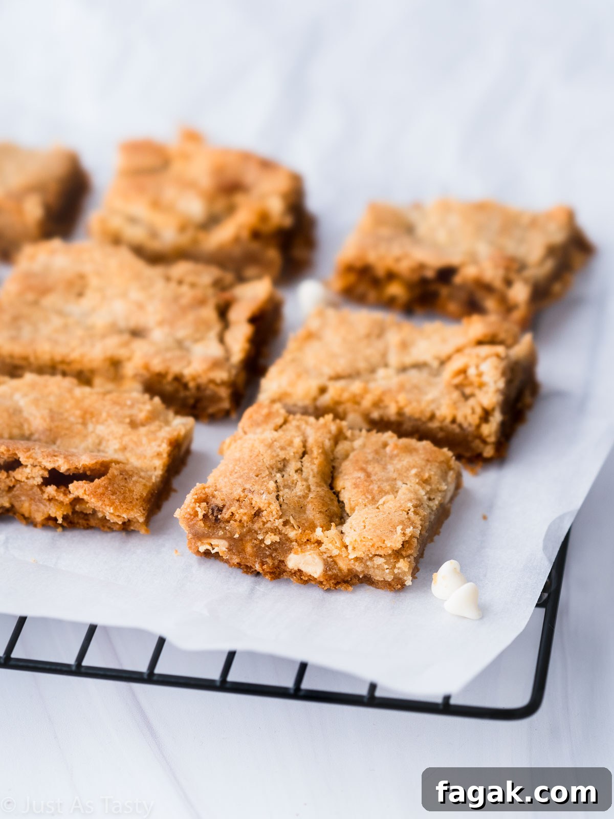 Decadent White Chocolate Brownie Recipe for Ultimate Indulgence 9 White chocolate brownies on a cooling rack.