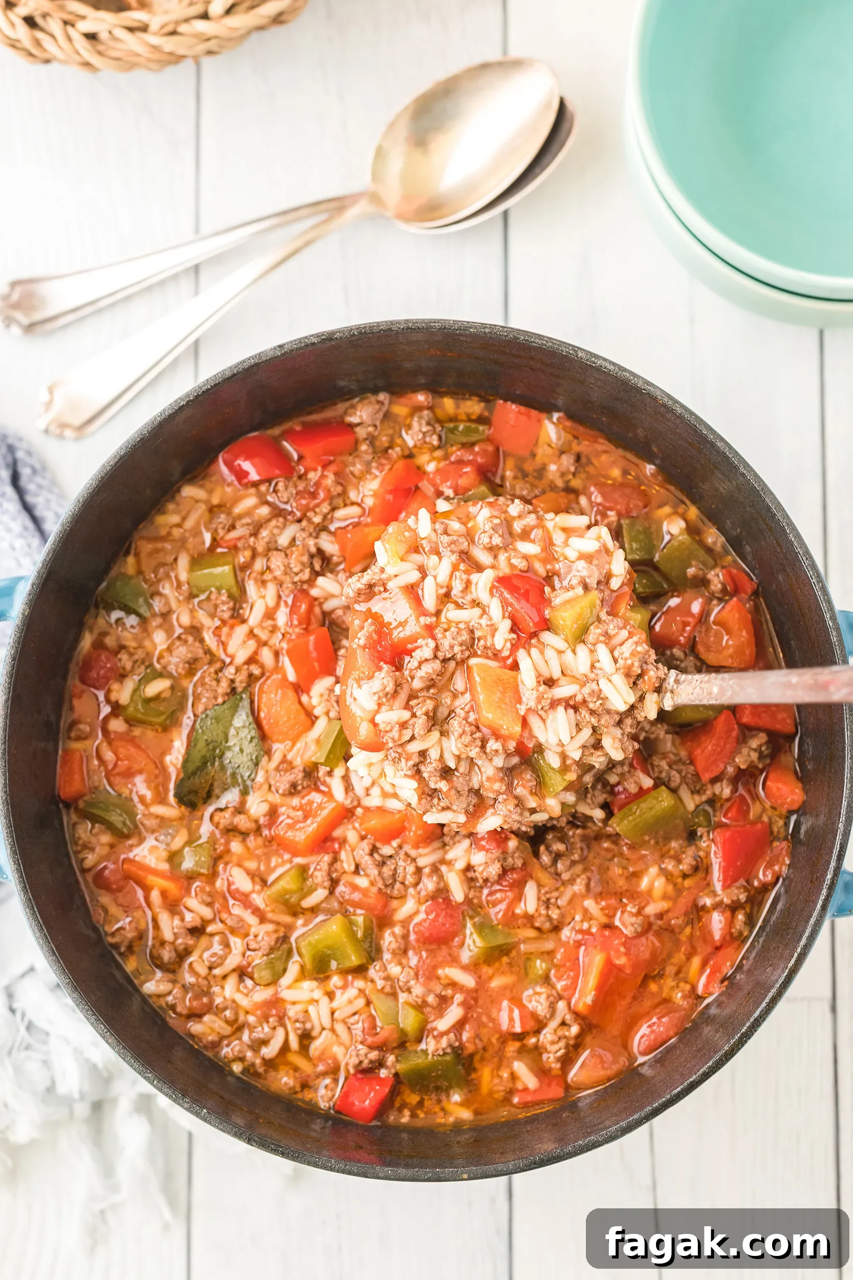 stuffed pepper soup being ladled out of the Dutch oven