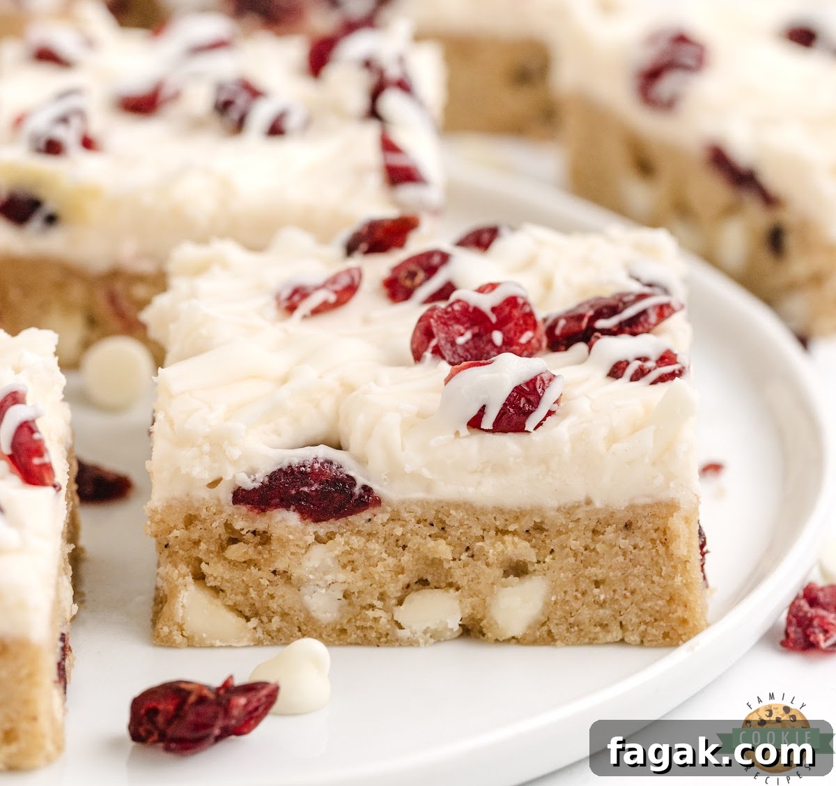 White Chocolate Cranberry Cookie Bars Recipe for Holiday Baking 2 White Chocolate Cranberry Cookie Bars are soft, chewy, and covered with cream cheese frosting and a white chocolate drizzle.