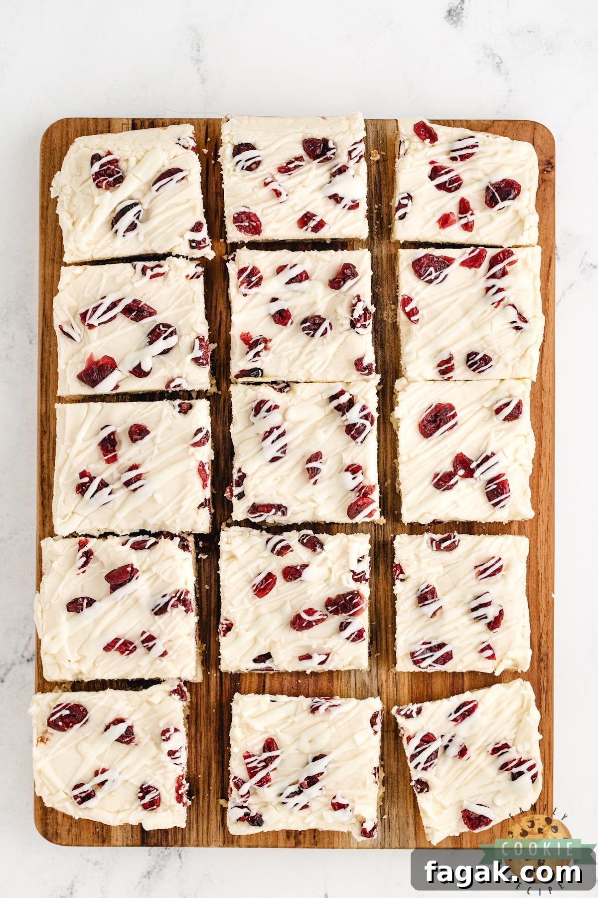 White Chocolate Cranberry Cookie Bars Recipe for Holiday Baking 3 Cookie bars made with cream cheese frosting and dried cranberries.