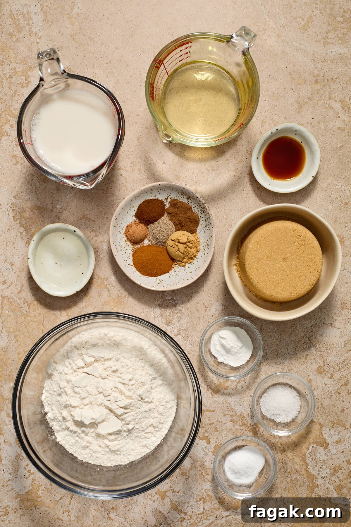 Ingredients to make chai spice cake arranged in individual dishes.