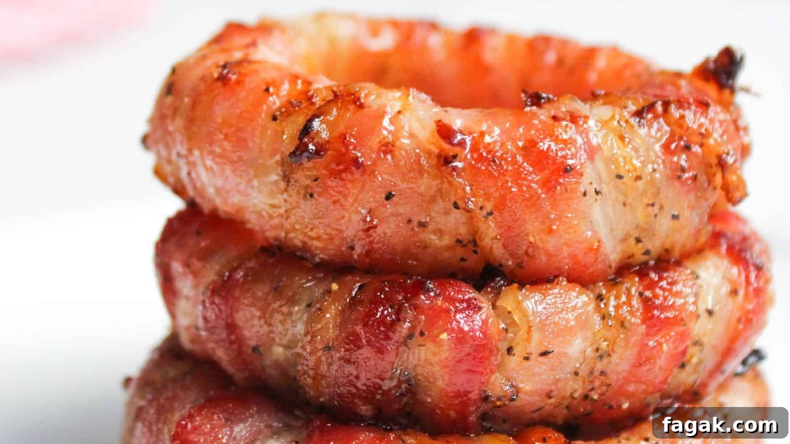 Stack of bacon wrapped onion rings.
