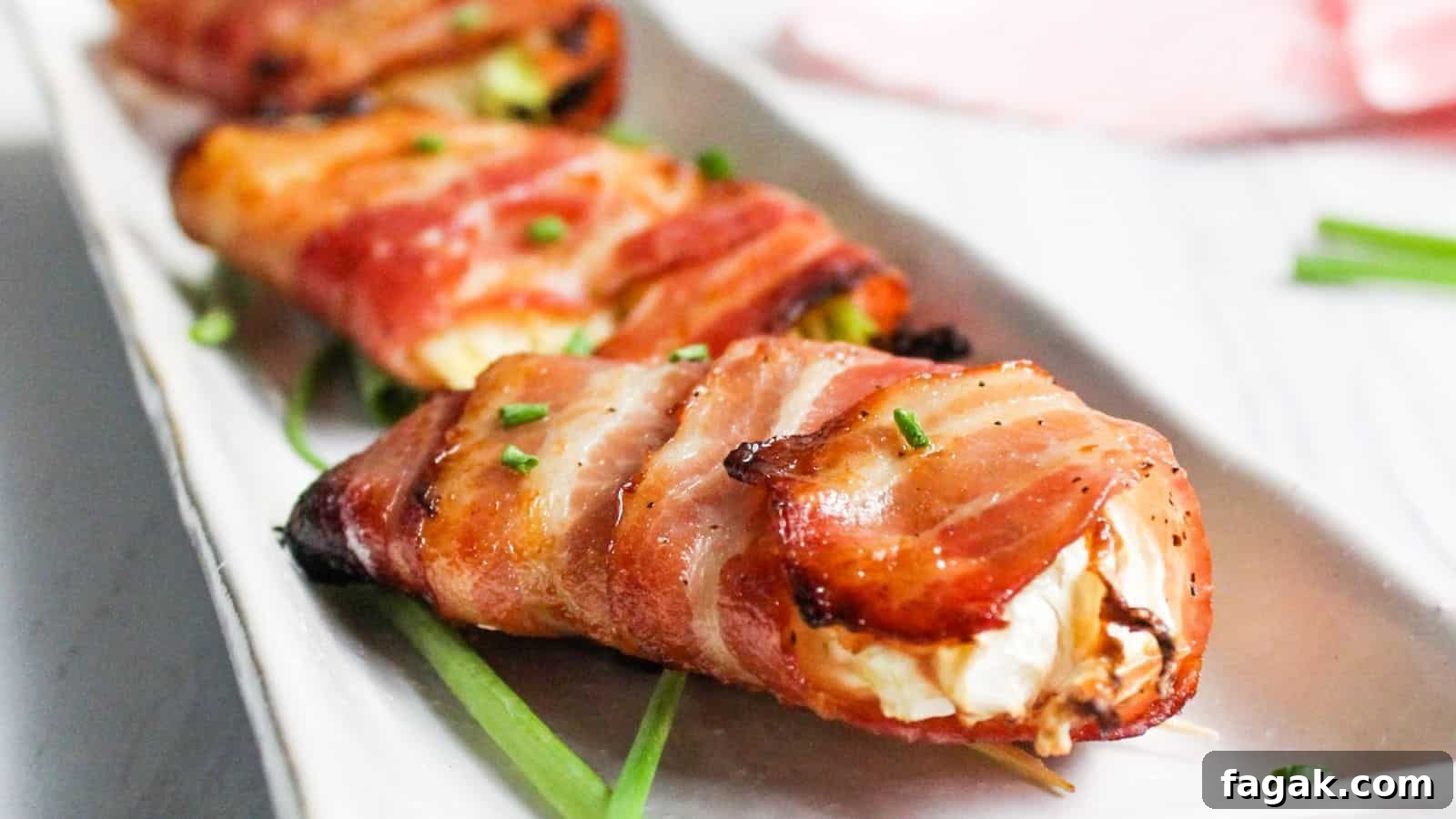 Bacon wrapped air fryer cabbage on white plate.