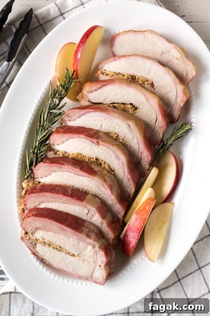 sliced smoked pork loin roast on a white platter