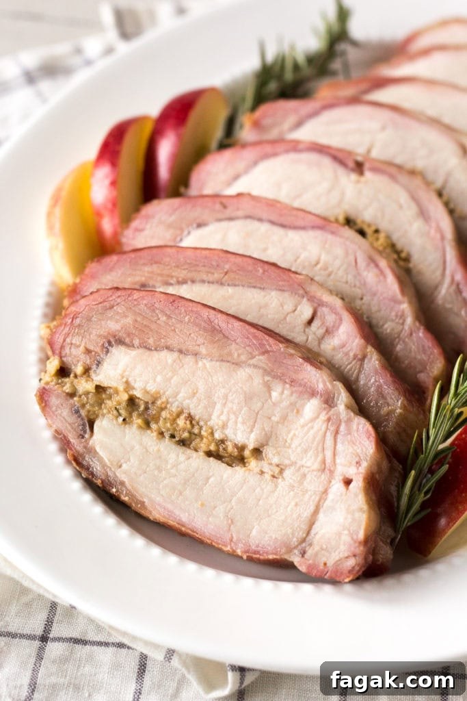 close up of sliced and smoked pork loin roast on a platter