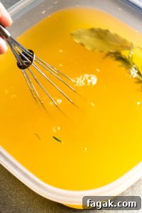 stirring salt into a brine solution with a whisk
