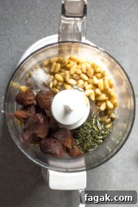 chopped apricot, rosemary, pine nuts, and kosher salt in a mini food processor