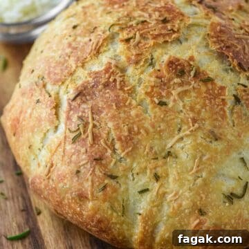close-up of rosemary parmesan bread on wood board