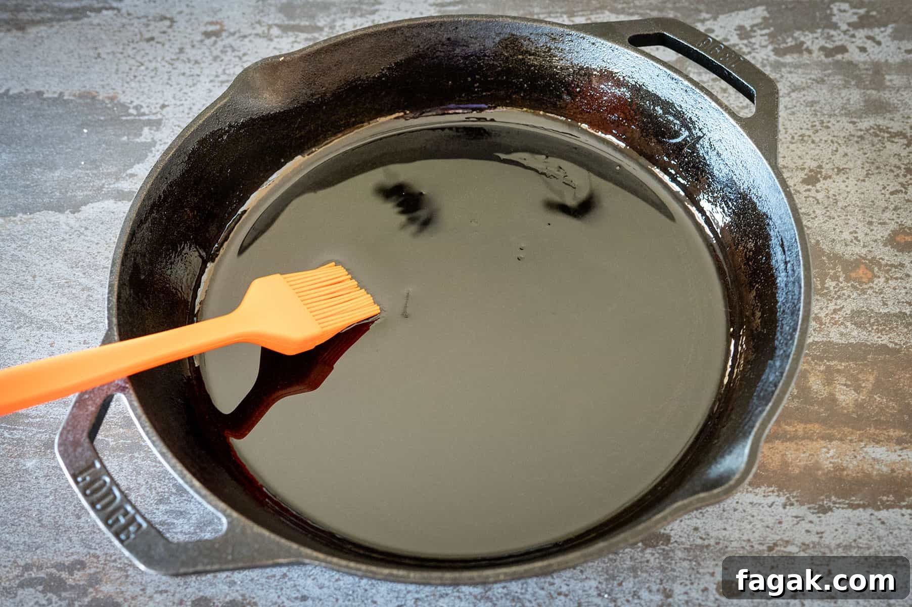 brushing oil in a skillet.