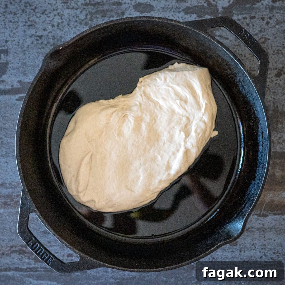 pizza dough in skillet.