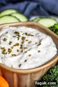 Close up shot of ranch dip in gray bowl.
