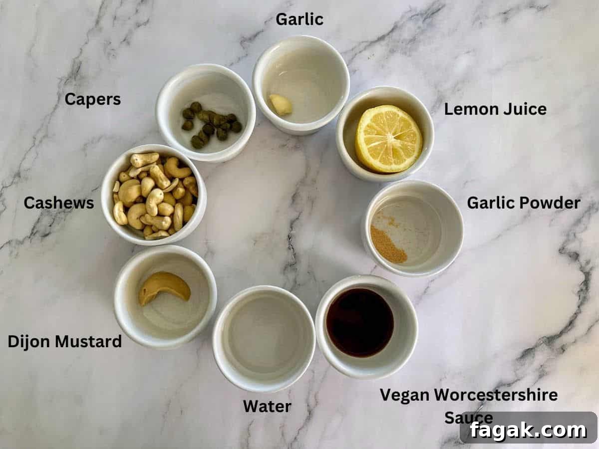 5-Minute Vegan Caesar Dressing Recipe: Creamy Plant-Based Dressing 3 Dressing ingredients in bowls: cashews, dijon mustard, water, vegan Worcestershire sauce, garlic powder, lemon juice, garlic, and capers.