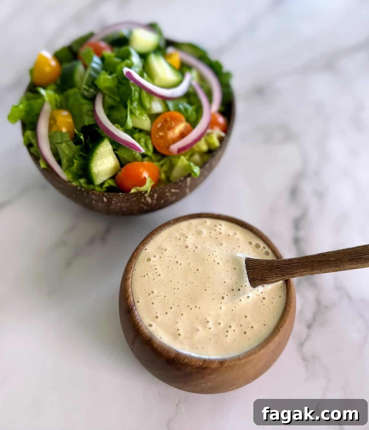 5-Minute Vegan Caesar Dressing Recipe: Creamy Plant-Based Dressing 4 Vegan Caesar dressing recipe in a bowl on the counter with a salad.