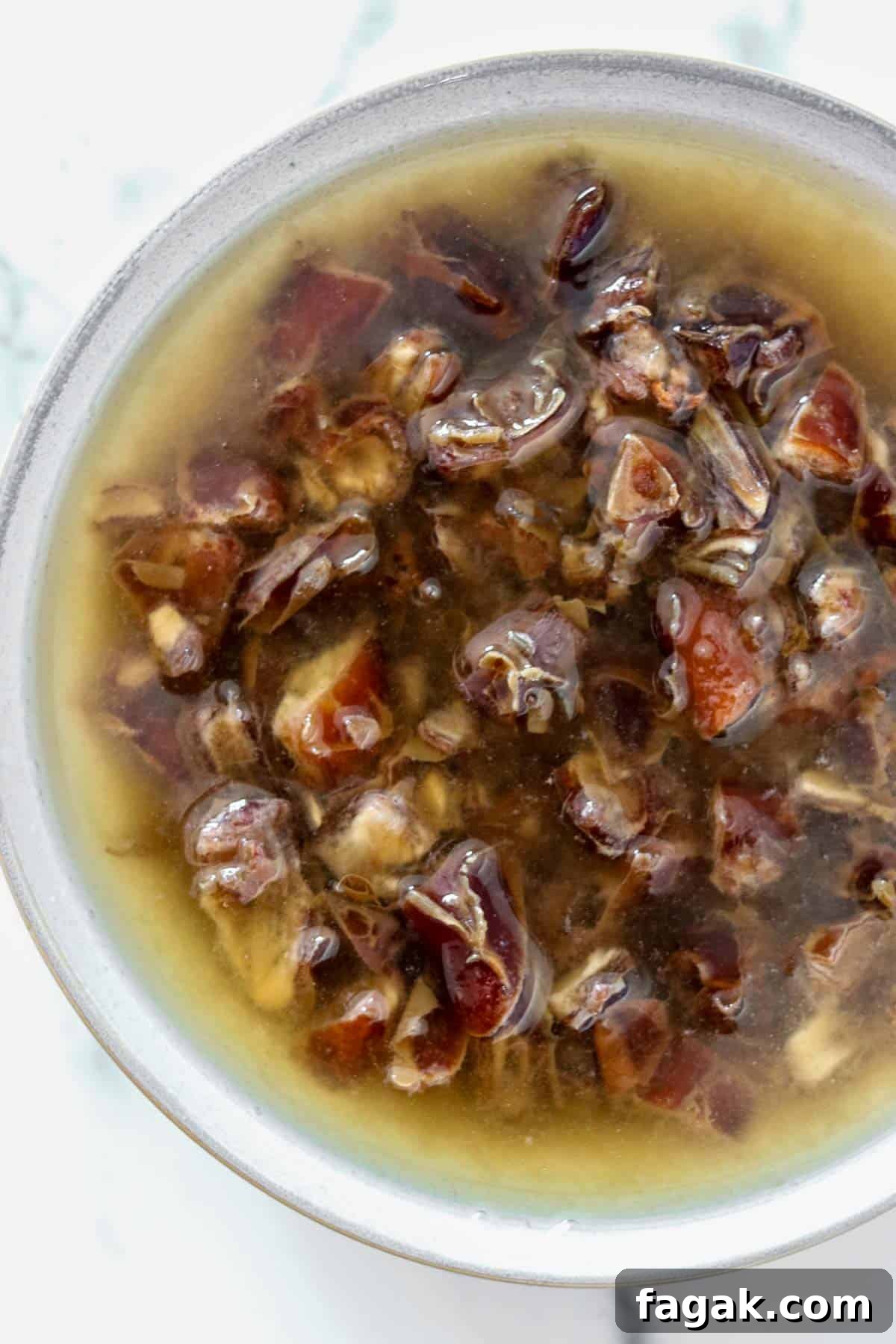 Chopped dates soaking in water.