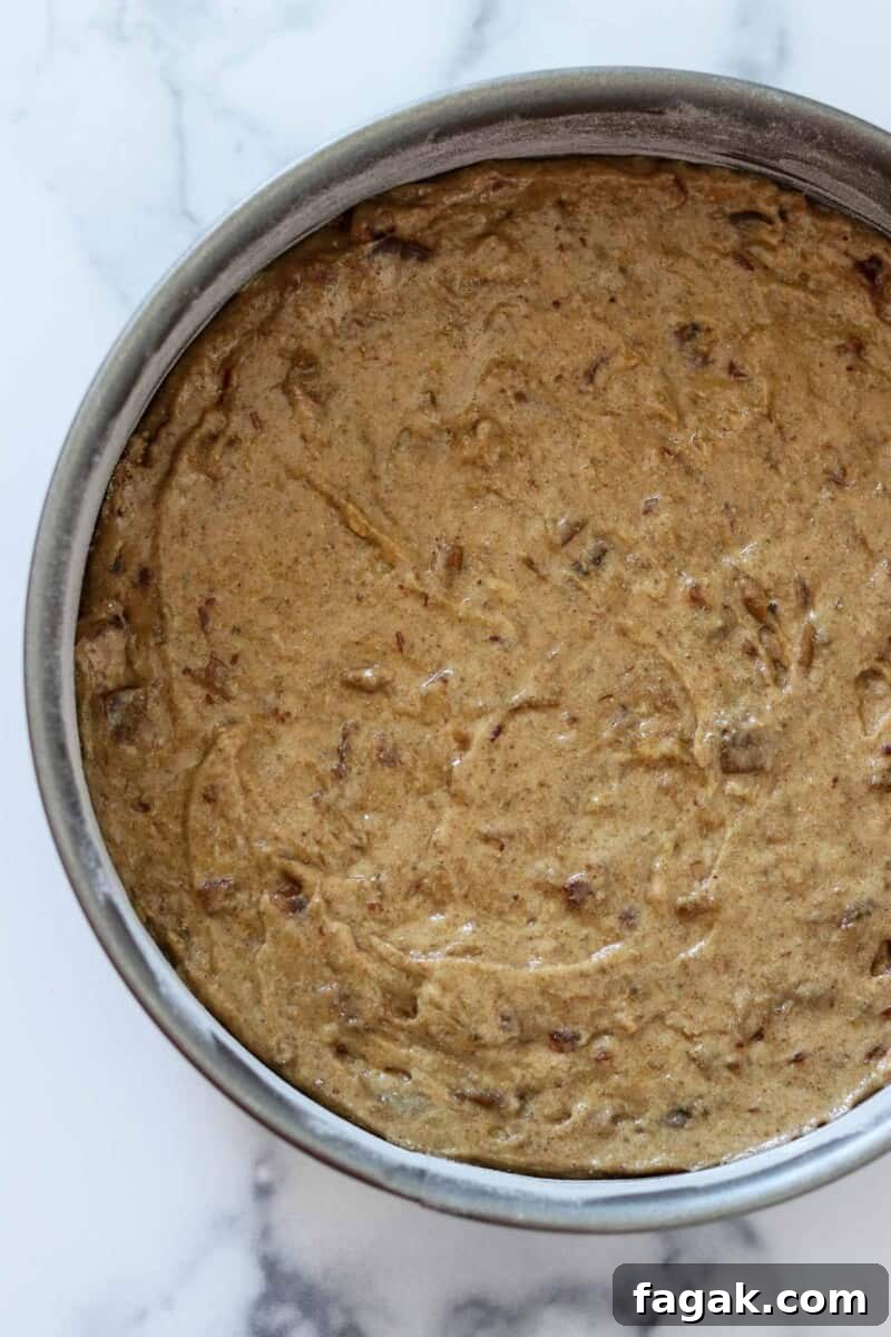 Date cake batter in a cake pan.