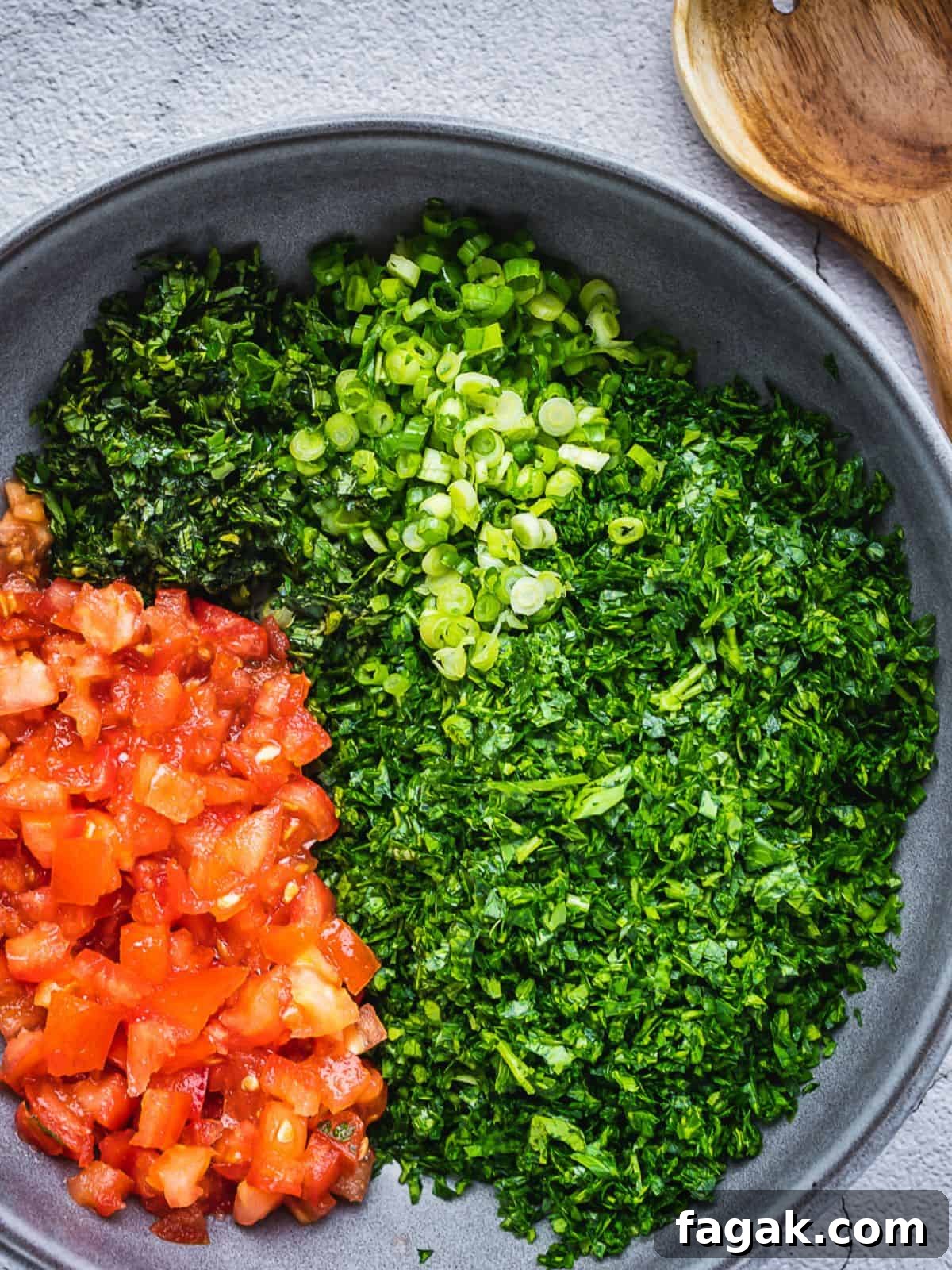 Tabbouleh fresh ingredients sitting in a bowl.