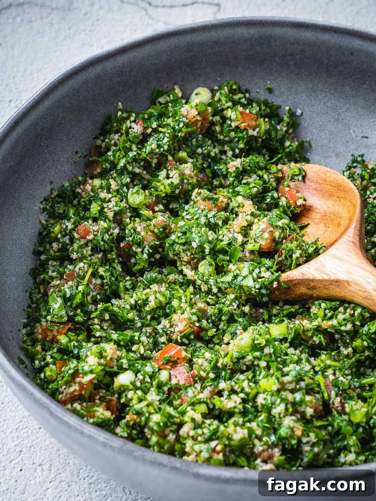 Tossed Tabbouleh salad in a bowl ready to be enjoyed.