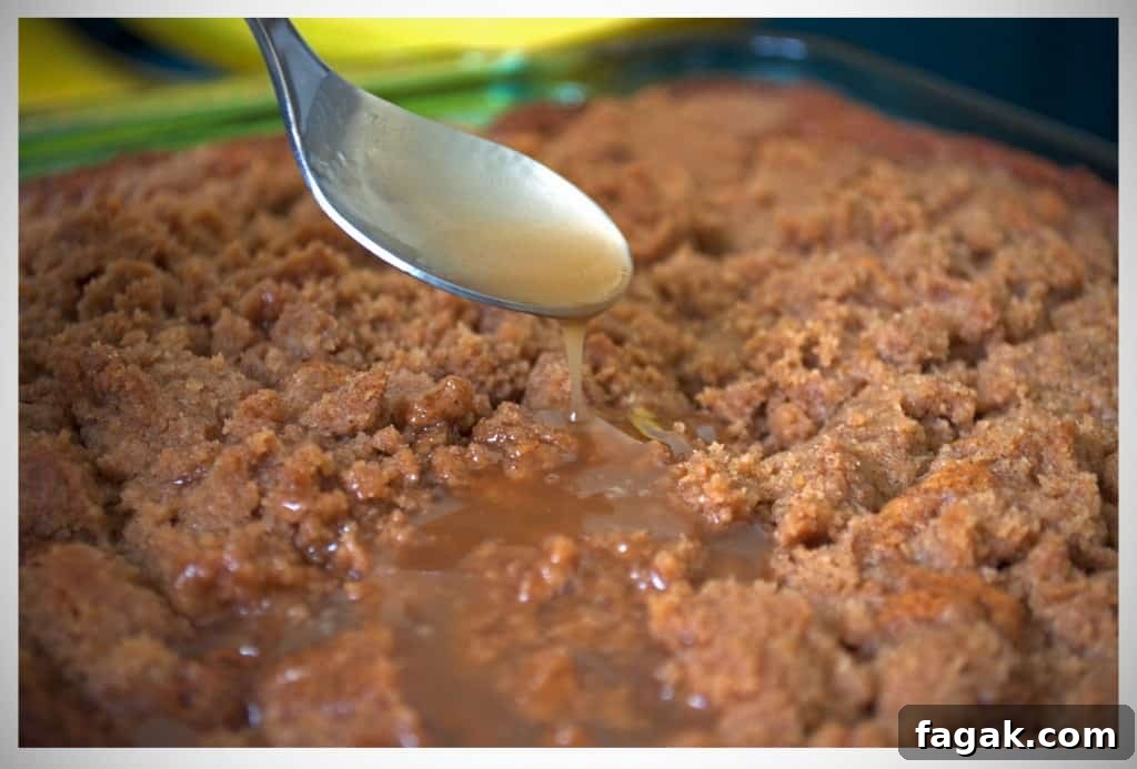 Banana Crumb Cake with Caramel Rum Sauce | OfBatterAndDough.com