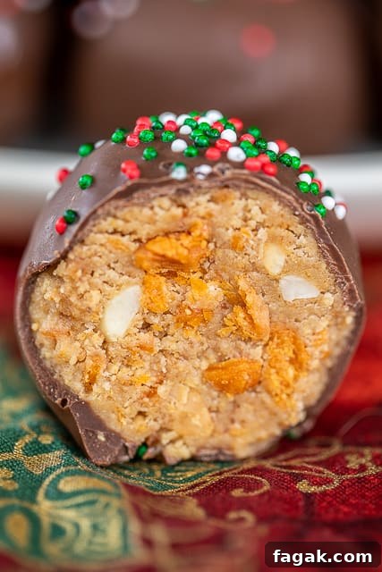 Butterfinger Balls - dangerously delicious!! Peanut butter, powdered sugar, graham crackers, Butterfinger bits, butter and chocolate candy coating.