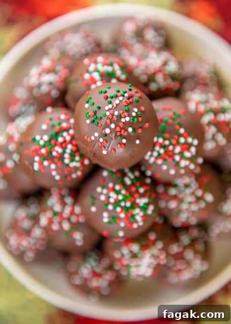 Butterfinger Balls - dangerously delicious!! Peanut butter, powdered sugar, graham crackers, Butterfinger bits, butter and chocolate candy coating.