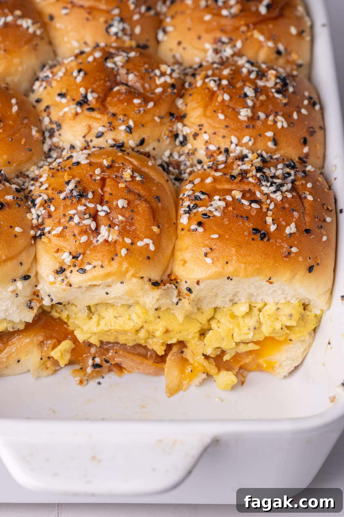 Hawaiian roll breakfast sliders still warm in the casserole dish.