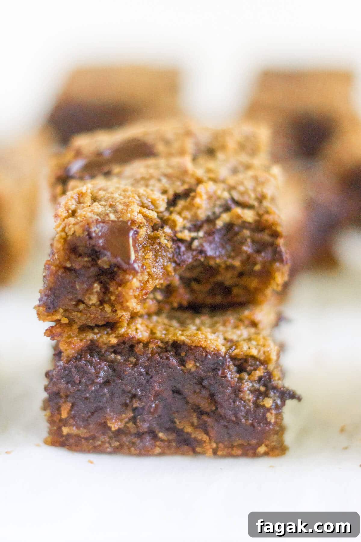 Paleo Pumpkin Chocolate Chunk Blondies are a healthier alternative to all your pumpkin desserts! These paleo blondies are thick and chewy and filled with pumpkin and extra large chocolate chunks.