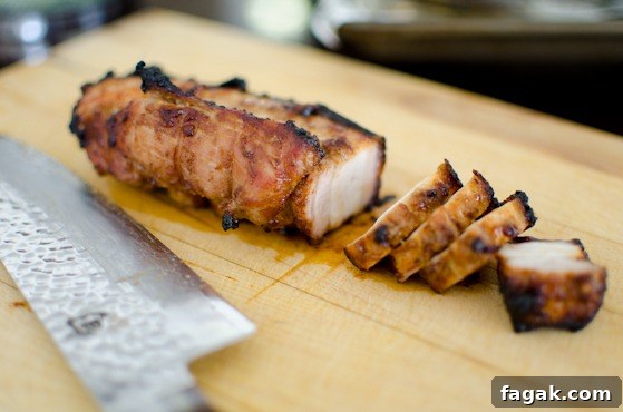 Slice oven roasted Korean pork belly into bite size pieces.