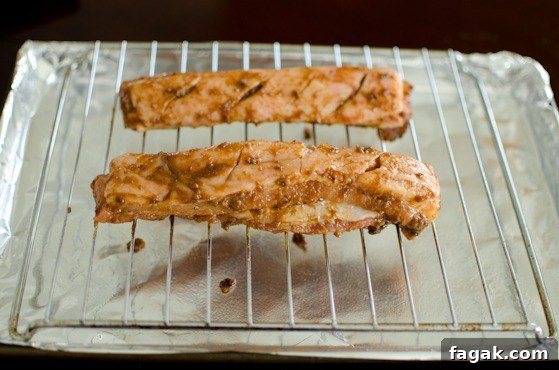 Place pork bellies on a broiling rack over a pan lined with foil