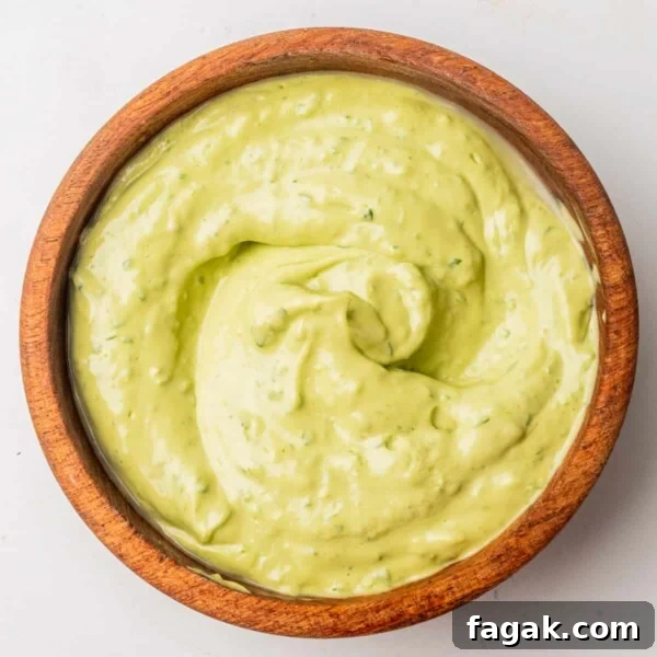 An overhead image of avocado cilantro lime dressing in a bowl.