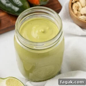 A close up image of poblano sauce in a mason jar.