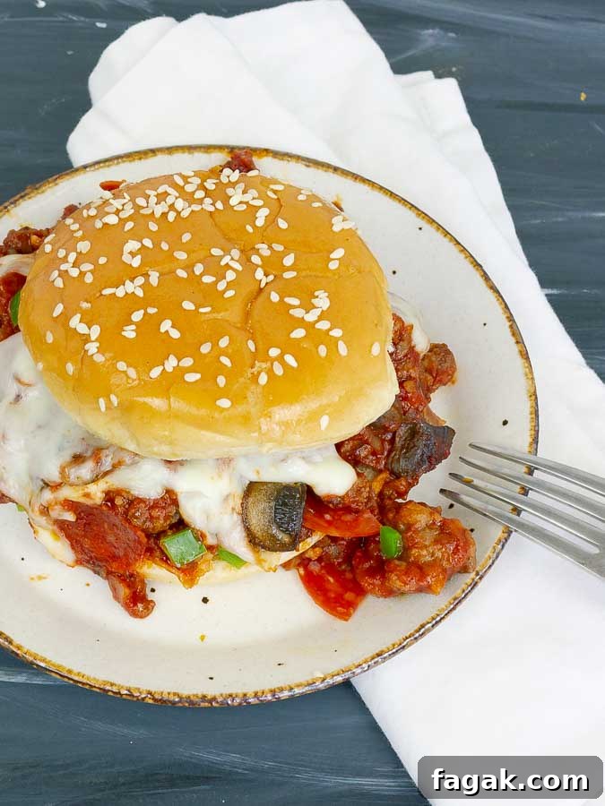 pizza sloppy joe sandwich on white plate