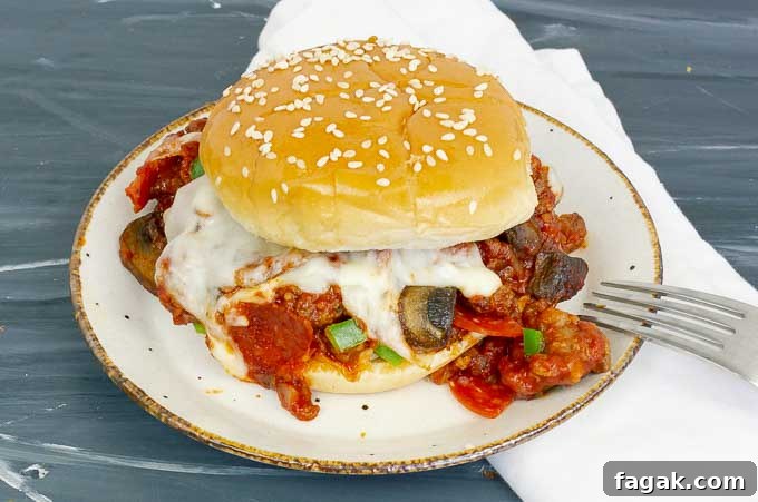 pizza sloppy joe sandwich on white plate