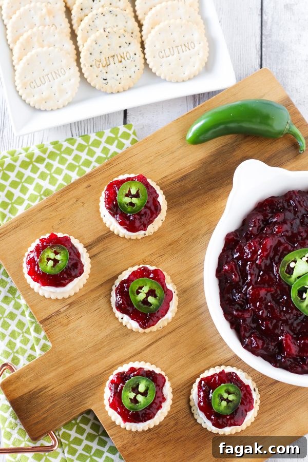 Sweet and Spicy Cranberry Jalapeño Chutney. Served on top of Glutino gluten free crackers with a little dairy free cream cheese and fresh jalapeño slices.
