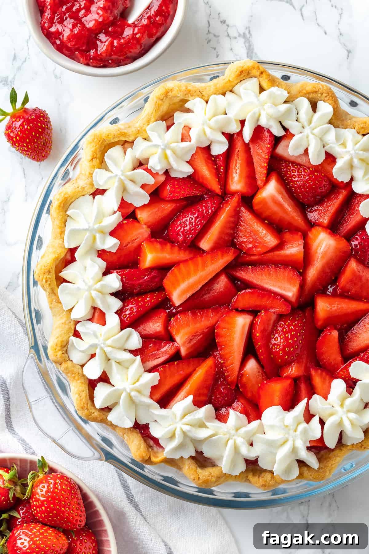 Overhead view of strawberry cream pie in glass pie pan