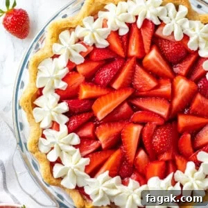 Overhead view of strawberry cream pie in glass pie pan