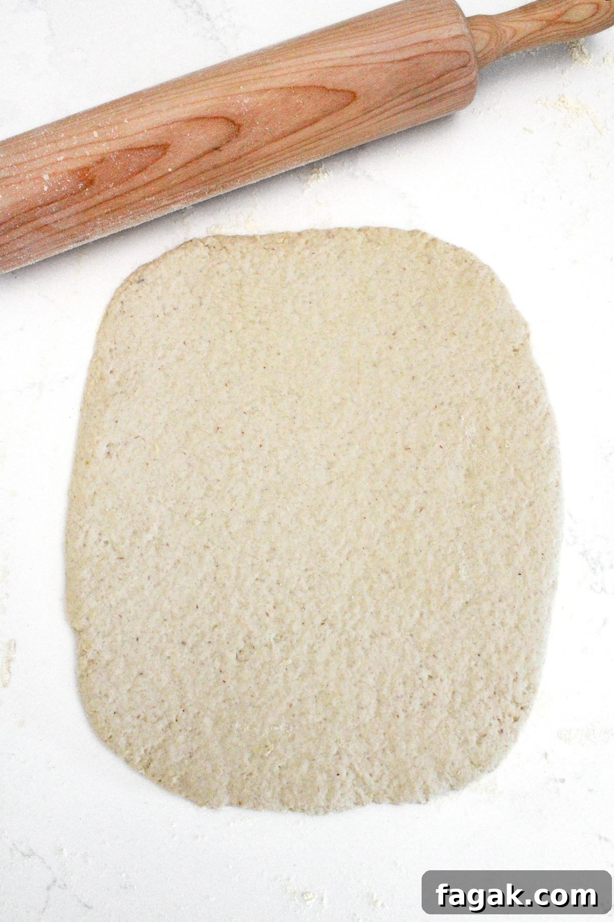 Rolled dough on marble board