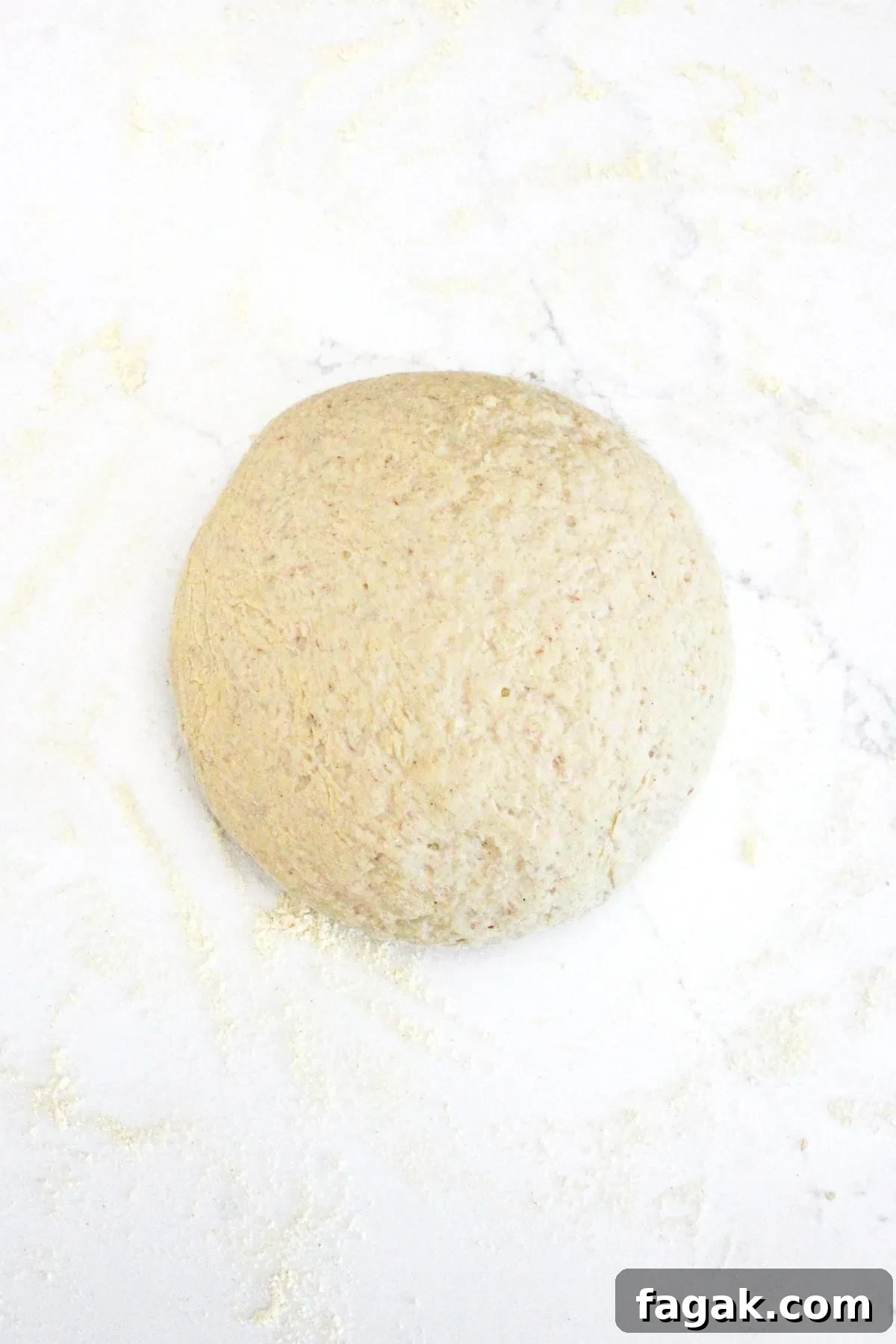 A ball of dough on marble board