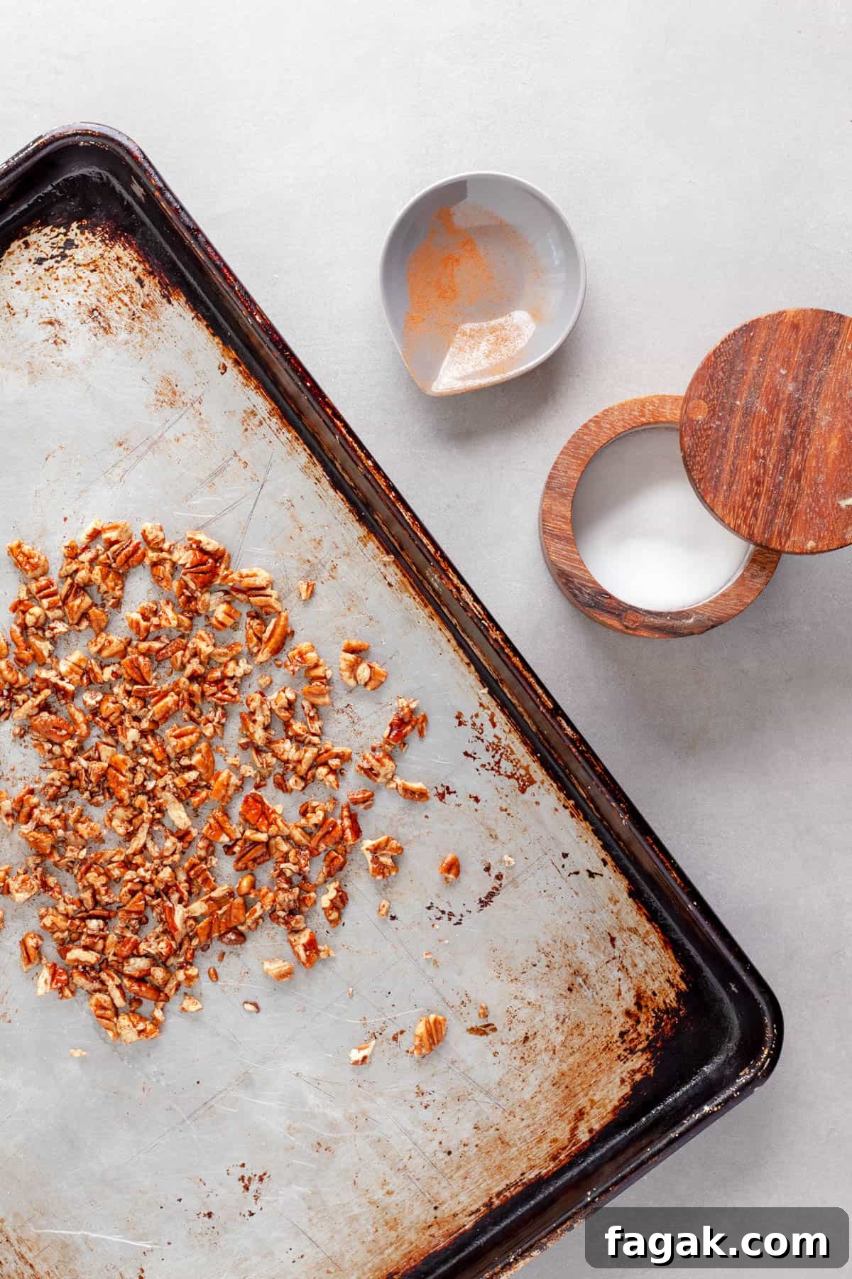 Chopped pecans tossed with olive oil, maple syrup, cinnamon and cayenne pepper for a salad topper.