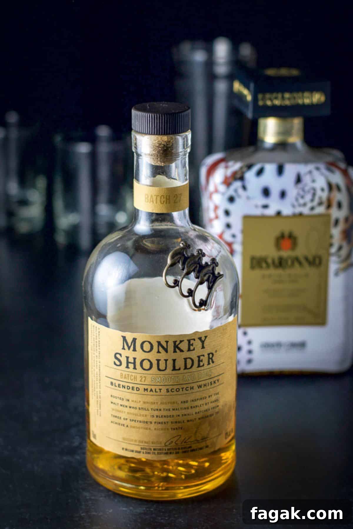 How to Make a Classic Godfather Cocktail: Recipe & Tips 3 Scotch, almond liqueur in front of a cocktail shaker and 2 glasses